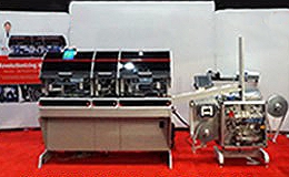 assembly machine and packaging equipment for diagnostic test kits